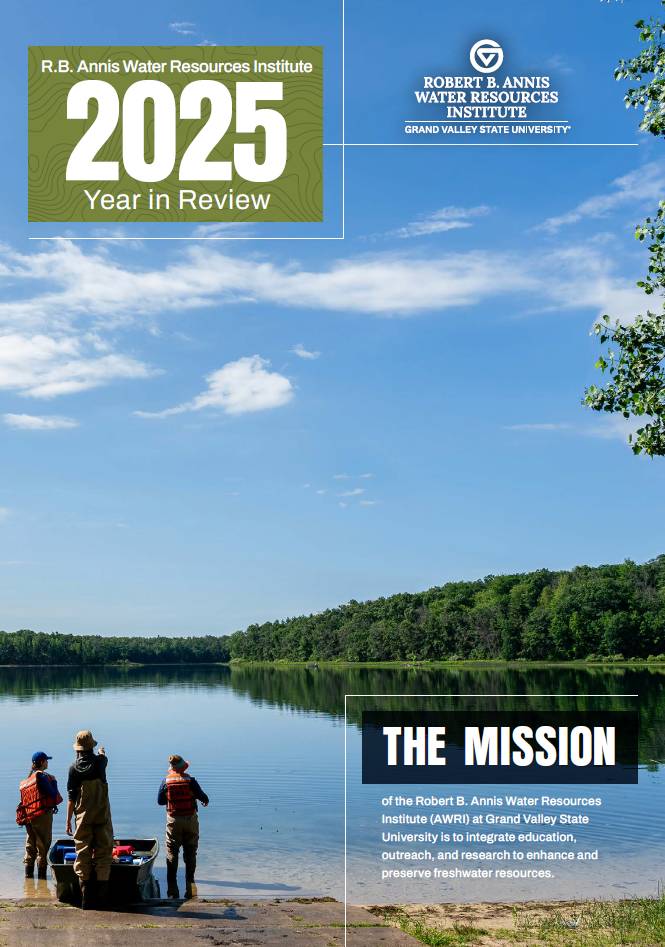 GVSU AWRI 2025 Year in Review magazine cover depicting a group of researchers standing on a shoreline looking out across the lake.